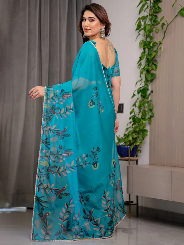 Teal_Green_Printed_Organza_Saree_with_Floral_&_Bird_Motifs_and_Multicolour_Lace_Border_|_Designer_Lightweight_Organza_Saree_with_Attached_Blouse_Piece_|_Elegant_Festive_&_Party_Wear_Saree