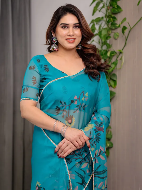 Teal_Green_Printed_Organza_Saree_with_Floral_&_Bird_Motifs_and_Multicolour_Lace_Border_|_Designer_Lightweight_Organza_Saree_with_Attached_Blouse_Piece_|_Elegant_Festive_&_Party_Wear_Saree