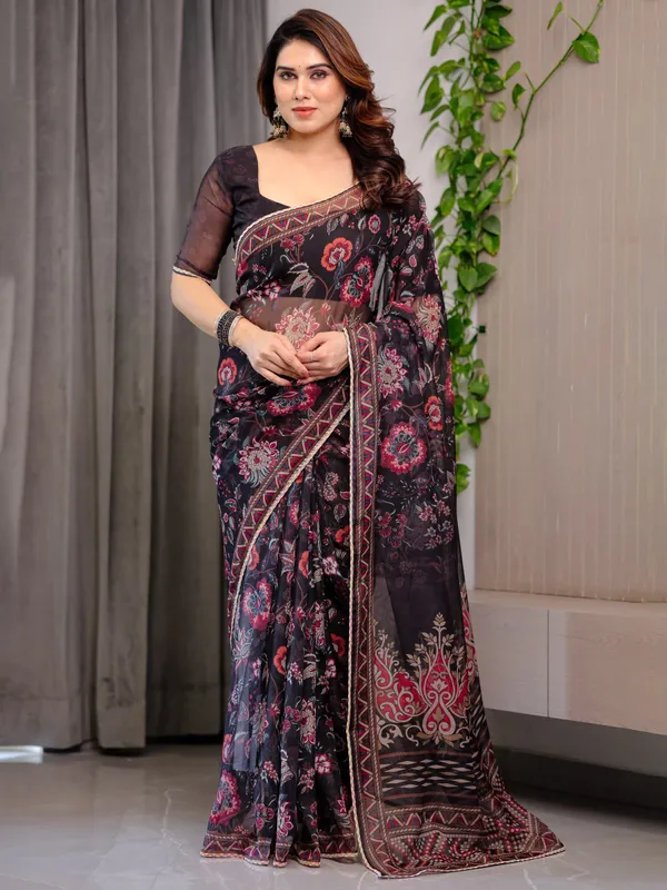 Black_Floral_Printed_Organza_Saree_with_Ethnic_Border_&_Ornamental_Pallu_|_Designer_Sheer_Organza_Saree_with_Traditional_Motifs_&_Blouse_Piece_|_Elegant_Festive_&_Party_Wear_Saree
