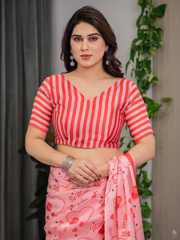 Blush_Pink_&_Coral_Red_Heart_Print_Satin_Georgette_Saree_with_Romantic_Love_Typography_Pallu_and_Attached_Striped_Blouse_–_5.5_Meter_Designer_Saree_for_Valentine’s_Day_&_Anniversary_Wear
