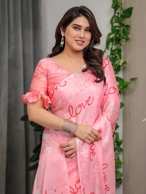 Blush_Pink_Satin_Georgette_Saree_with_All-Over_Love_Typography_Print_and_Attached_Matching_Printed_Blouse_–_5.5_Meter_Romantic_Designer_Saree_for_Valentine’s_Day_&_Anniversary_Wear