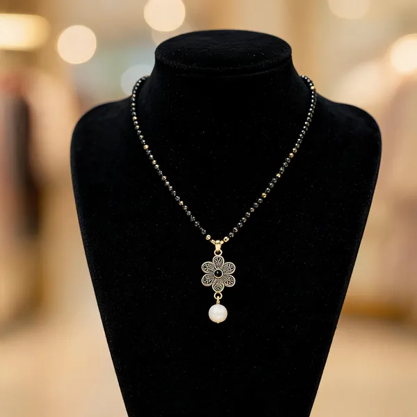 Black_Beaded_Gold_Toned_Floral_Pearl_Pendant_Mangalsutra_For_Women