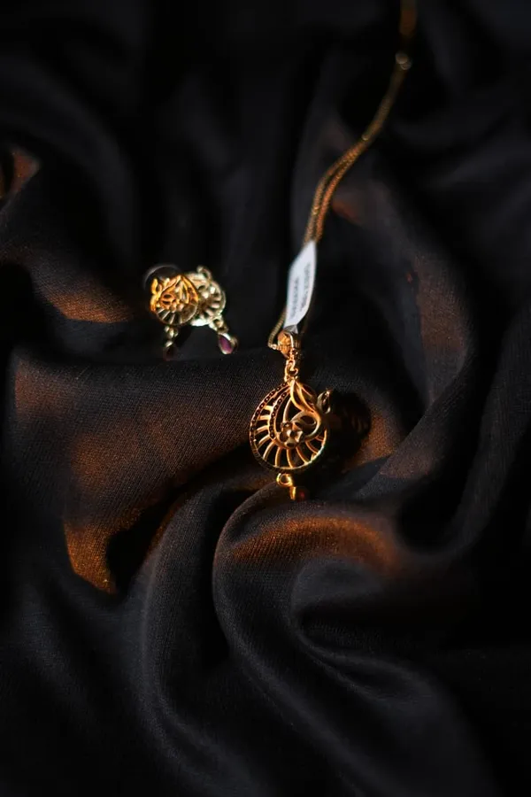 Gold_Peacock_Motif_Pendant_Earrings_With_Ruby_Accents