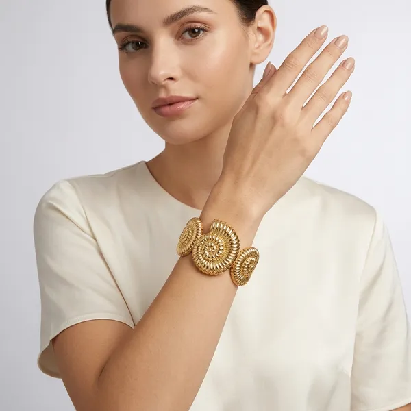 Gold_Toned_Spiral_Shell_Design_Statement_Bracelet_For_Women