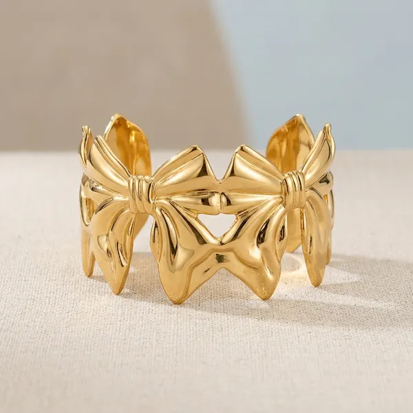 Gold_Toned_Bow_Design_Statement_Bracelet_For_Women