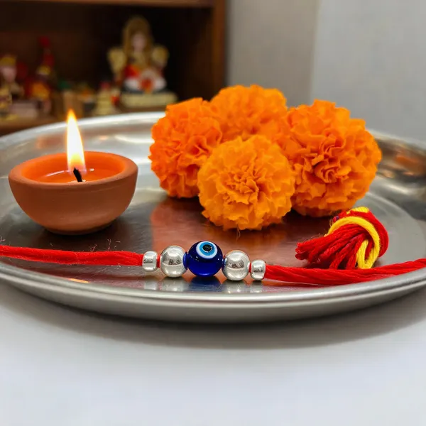 Silvering_Nazar_Suraksha_Bead_Thread_Rakhi_(design_2)