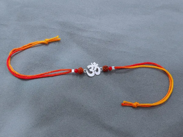 Silvering_Om_Cutwork_Rudraksha_925_Silver_Thread_Rakhi