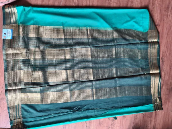 Teal_Semi_Crepe_Silk_Zari_Border_Ethnic_Saree_For_Women