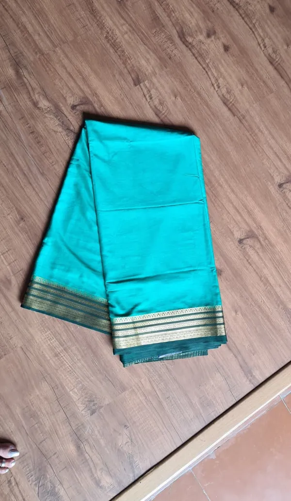 Teal_Semi_Crepe_Silk_Zari_Border_Ethnic_Saree_For_Women
