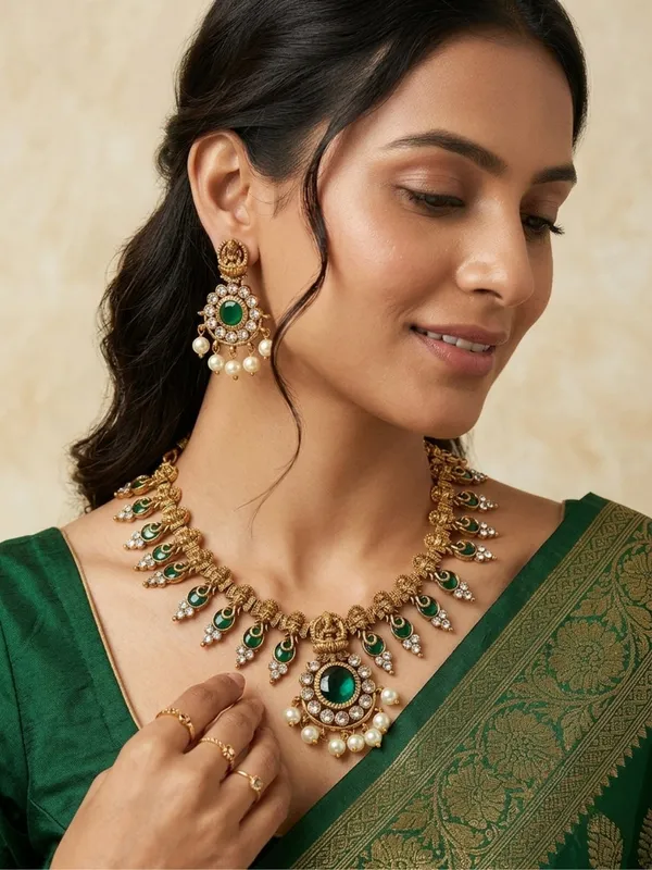Gold-Plated_Green_Stone_And_Kundan_Studded_Lakshmi_Temple_Necklace_Jewellery_Set
