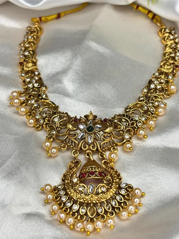 Gold-Plated_Kundan_Stone-Studded_Peacock_&_Jhumka_Pendant_Necklace_Jewellery_Set