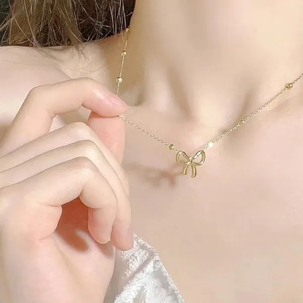 Gold_Stainless_Steel_Bow_Pendant_Necklace_Earrings_Set_For_Women_Pack_Of_2