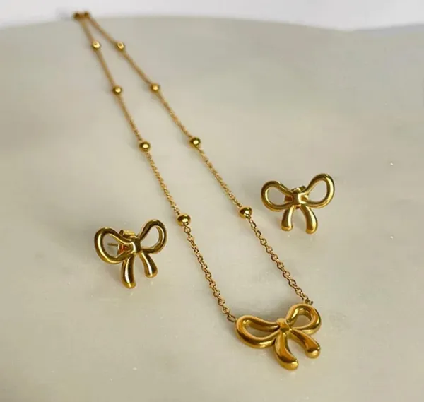 Gold_Stainless_Steel_Bow_Pendant_Necklace_Earrings_Set_For_Women_Pack_Of_2