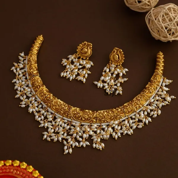 Gold_Brass_Pearl_Temple_Hasli_Necklace_Set_For_Women