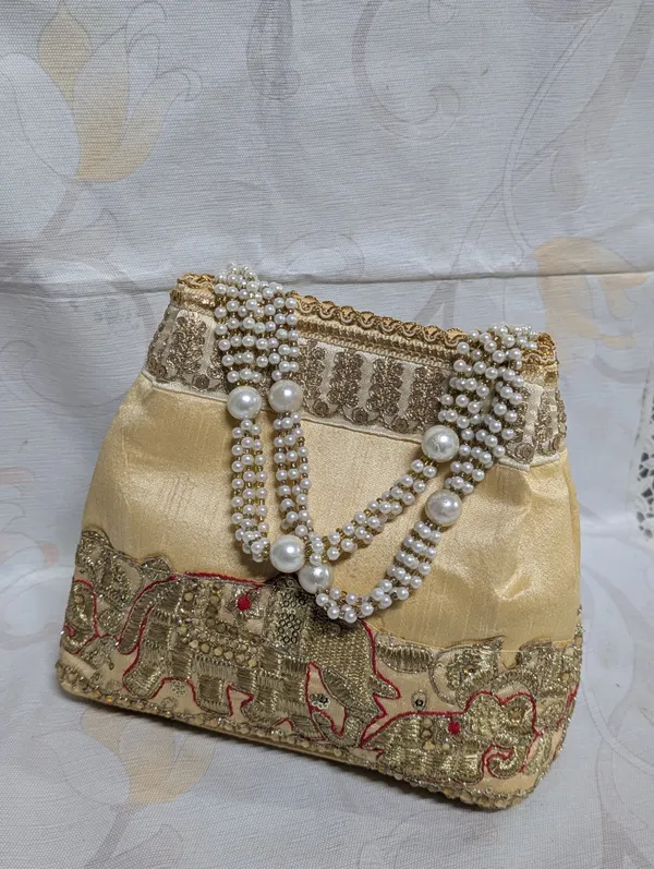 Cream_Silk_Gold_Peacock_Potli_Bag_For_Women