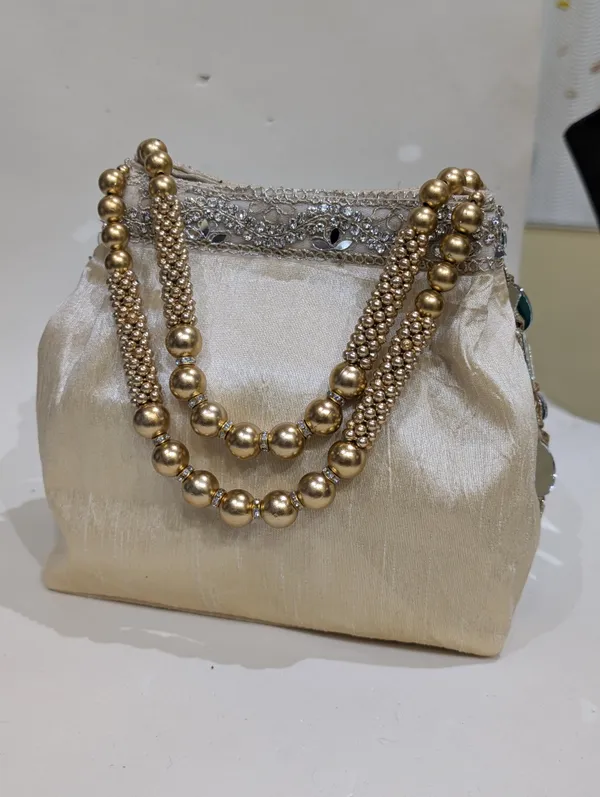 Golden_Silk_Mirror_Work_Embellished_Potli_Bag_For_Women