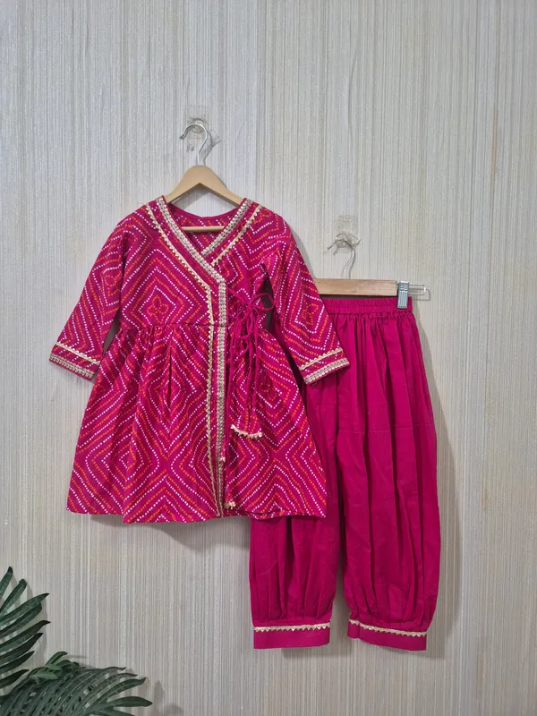 Dark_pink_cotton_angrakha_style_kurti_and_dhoti_set_for_little_girls__