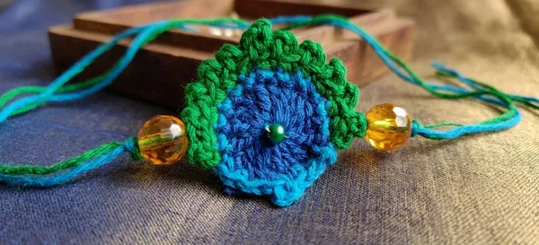 Blue_Cotton_Crochet_Peacock_Rakhi_for_Brothers