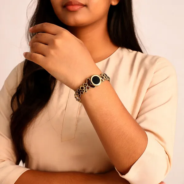 Gold_Toned_Metal_Cutout_Design_Bracelet_For_Women