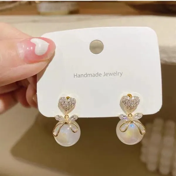 Gold_And_White_Alloy_Drop_Earrings_For_Women_Pack_Of_2