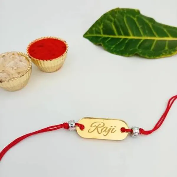 Golden_Acrylic_Name_Engraved_Rakhi_With_Red_Thread