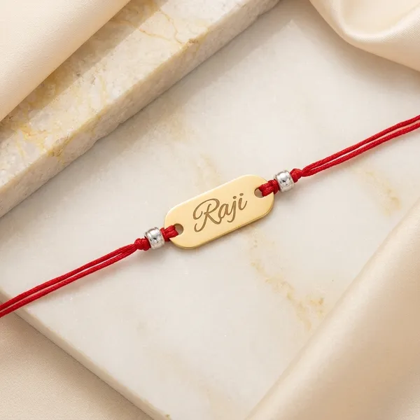 Golden_Acrylic_Name_Engraved_Rakhi_With_Red_Thread