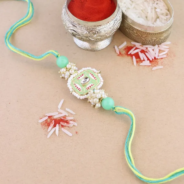 Mesmerizing_Kundan_And_Meena_Rakhi_With_Roli_Chawal_&_Card