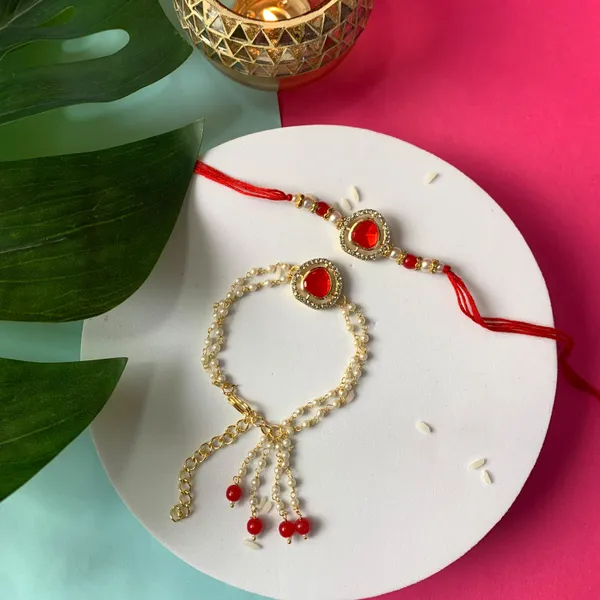 Elegant_Bhaiya_Bhabhi_Lumba_&_Pearl_Rakhi_With_Roli_Chawal_&_Card