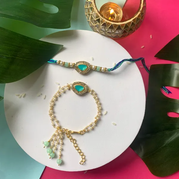 Elegant_Bhaiya_Bhabhi_Lumba_Pearl_&_Rakhi_With_Roli_Chawal_&_Card
