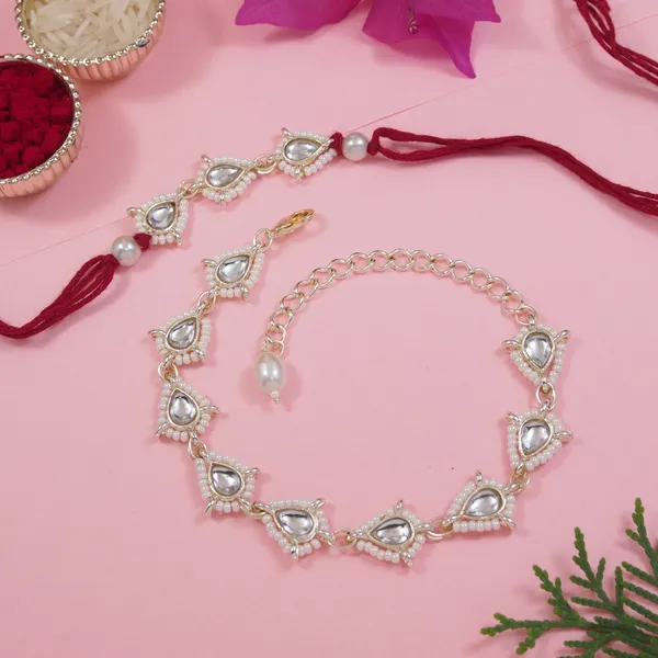 Elegant_Bhaiya_Bhabhi_Maroon_Lumba_Pearl_&_Rakhi_With_Roli_Chawal_&Card