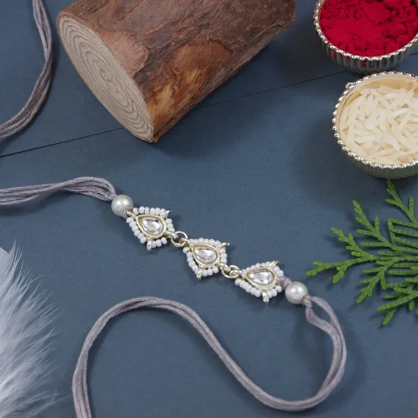Delicate_Pearl_Beads_Grey_Rakhi_with_Roli_Chawal_&_Rakshabandhan_Card