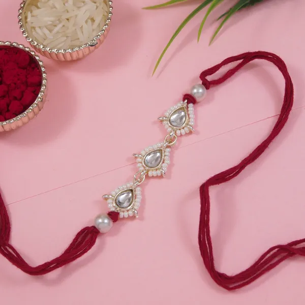 Delicate_Pearl_Beads_Maroon_Rakhi_with_Roli_Chawal_&_Rakshabandhan_Card