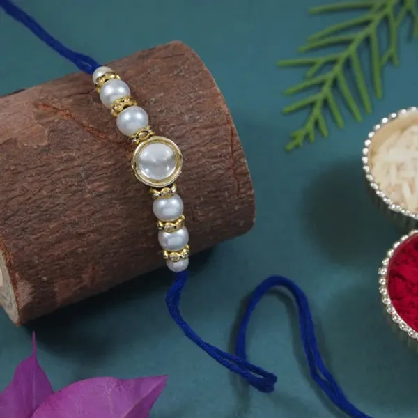 Delicate_Pearl_Beads_Blue_Rakhi_with_Roli_Chawal_&_Rakshabandhan_Card