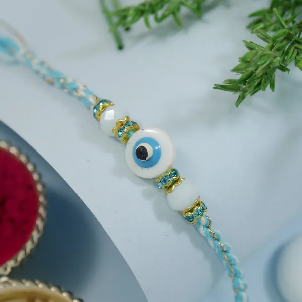 Blue_And_White_Thread_Beaded_Rakhi_For_Raksha_Bandhan_For_Brother