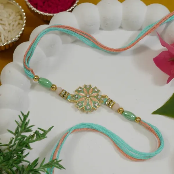 Elegant_Mint_Enamel_Floral_Rakhi_with_Roli_Chawal_&_Rakshabandhan_Card