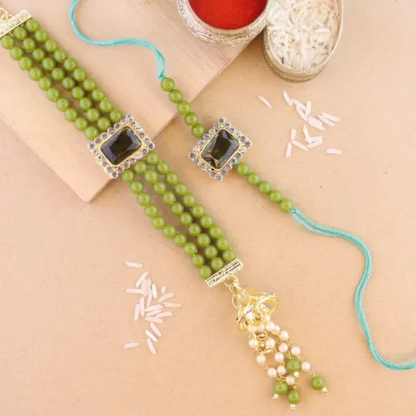 Elegant_Bhaiya_Bhabhi_Lumba_&_Pearl_Rakhi_With_Roli_Chawal_&_Card