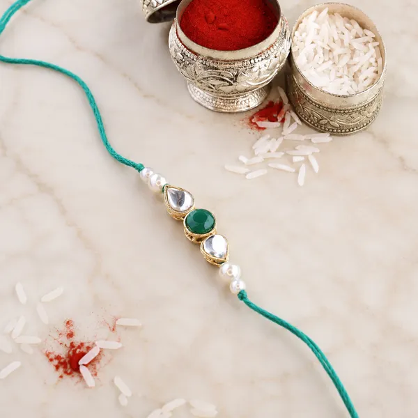 Dazzling_Pearl_Kundan_Stone_Rakhi_with_Roli_Chawal_&_Card