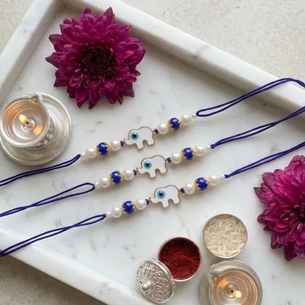 Elephant_Shape_Enamel_Bhaiya_Rakhi_With_Roli_Chawal_&_Card_(Pack_of_3)