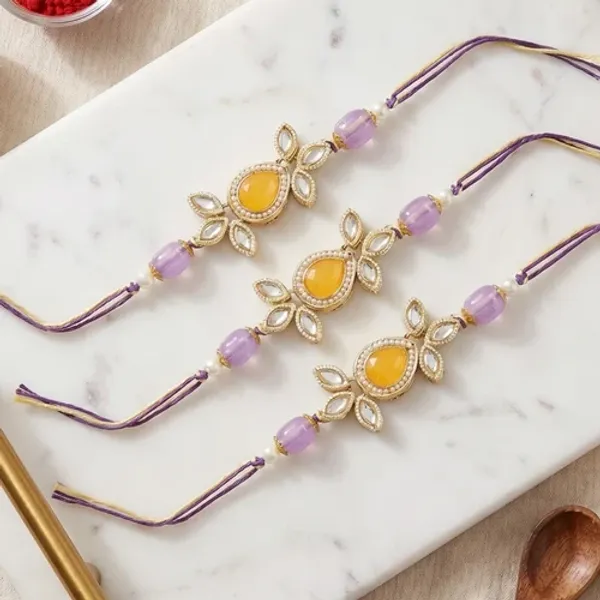 Beautiful_Kundan_&_Pearl_Rakhi_with_Roli_Chawal_&_Card_(Pack_of_3)