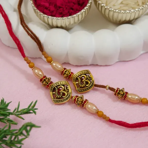 Antique_Beaded_OM_Rakhi_Combo_for_Bhai_-_Pack_of_2_with_Roli_Chawal