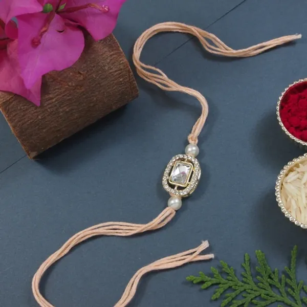 Delicate_Pearl_Beads_Peach_Rakhi_with_Roli_Chawal_&_Rakshabandhan_Card