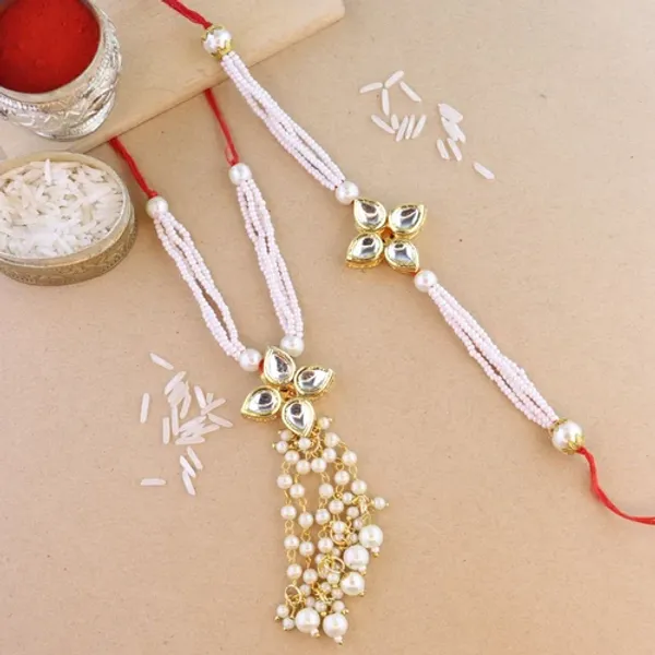 Elegant_Bhaiya_Bhabhi_Lumba_&_Pearl_Rakhi_With_Roli_Chawal_&_Card