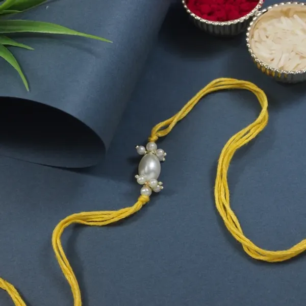 Delicate_Pearl_Beads_White_Rakhi_with_Roli_Chawal_&_Rakshabandhan_Card