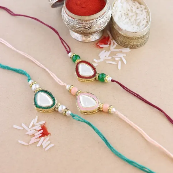 Dazzling_Pearl_Kundan_Stone_Rakhi_with_Roli_Chawal_&_Card_(Pack_of_3)
