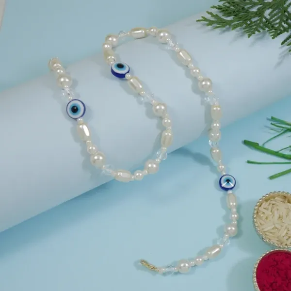 Elegant_Bhaiya_Bhabhi_Wrap_Around_Lumba_Pearl_Rakhi_With_Roli_Chawal_&_Rakshabandhan_Card