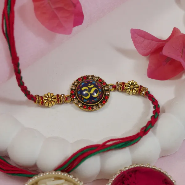 Enamel_Om_Rakhi_For_Bhai_-_Religious_Design_with_Roli_Chawal_&_Card