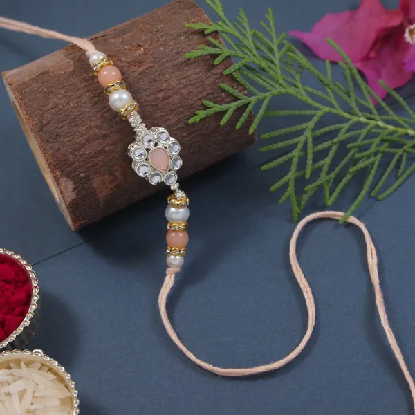Delicate_Pearl_Beads_Peach_Rakhi_with_Roli_Chawal_&_Rakshabandhan_Card