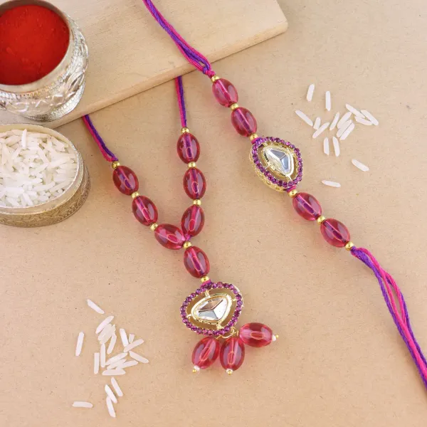 Elegant_Bhaiya_Bhabhi_Lumba_&_Pearl_Rakhi_With_Roli_Chawal_&_Card