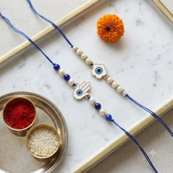 Floral_and_Hamsa_Shape_Enamel_Bhaiya_Rakhi_With_Roli_Chawal_&_Card_(Pack_of_2)