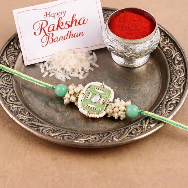 Mesmerizing_Kundan_And_Meena_Rakhi_With_Roli_Chawal_&_Card